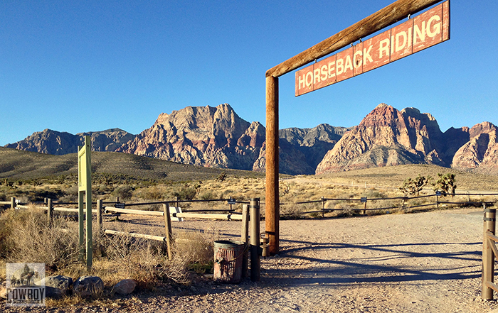 A picture of the Cowboy Trail Rides front gate at sunrise